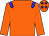 Orange body, blue epaulettes, orange arms, orange cap, blue stars (T Bouquet)