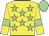 Yellow body, soft green stars, yellow arms, soft green armlets, soft green cap
